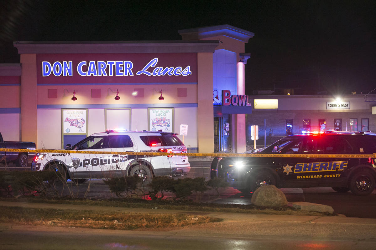 Rockford police and other law enforcement agencies investigate the scene of a shooting at a bow ...