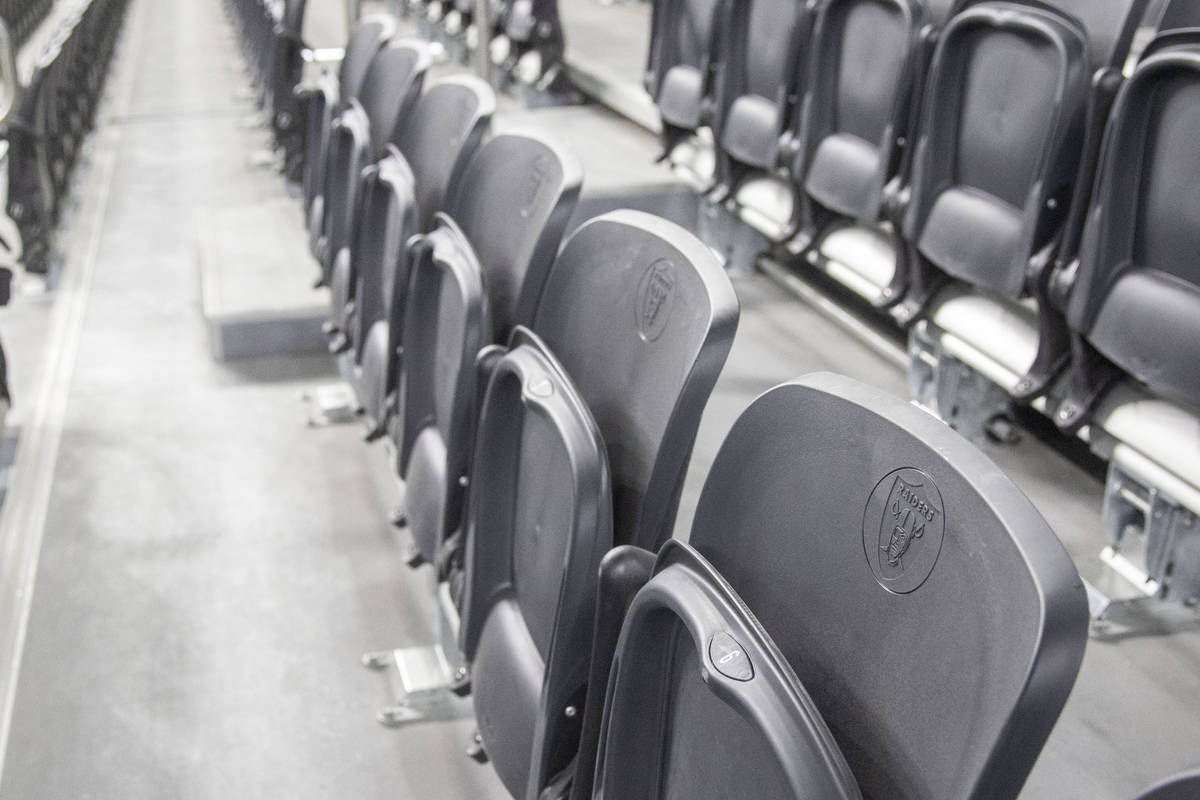 The Raiders logo is seen on empty seats during the fourth quarter of an NFL football game betwe ...