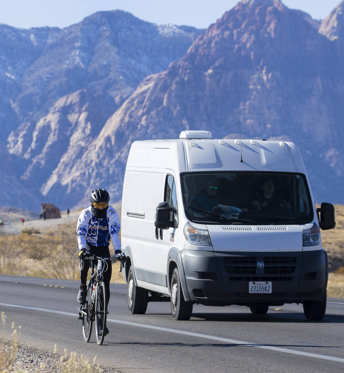 A cyclist rides his bike along the Charleston Blvd near Red Rock, on Tuesday, Dec. 29, 2020, in ...