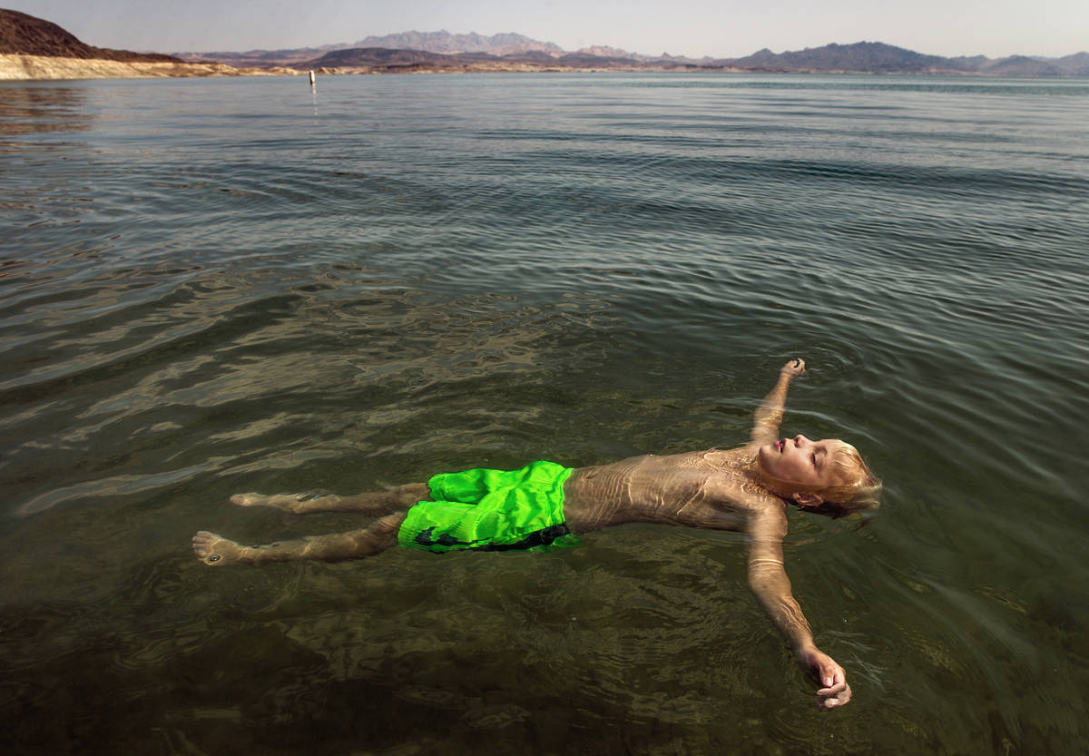 Lucas Schoon, 10, of Glenwood Springs, Colorado, floats at Boulder Beach while joining family a ...