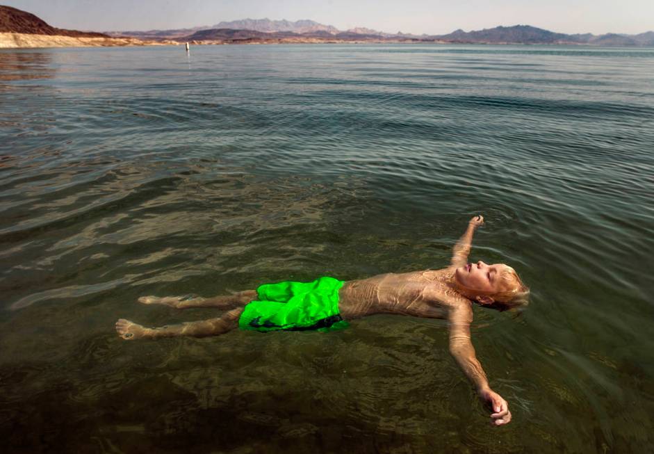 Lucas Schoon, 10, of Glenwood Springs, Colorado, floats at Boulder Beach while joining family a ...