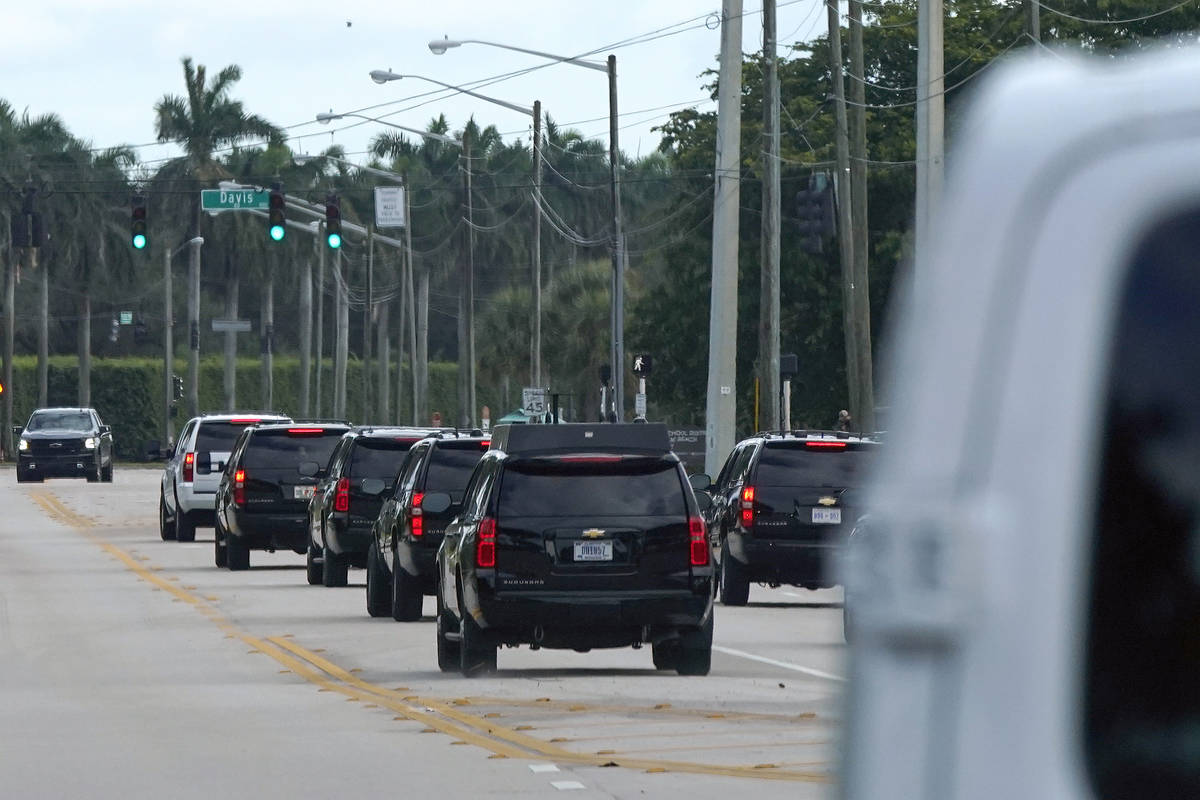 President Donald Trump's motorcade drives to Trump International Golf Club, Monday, Dec. 28, 20 ...