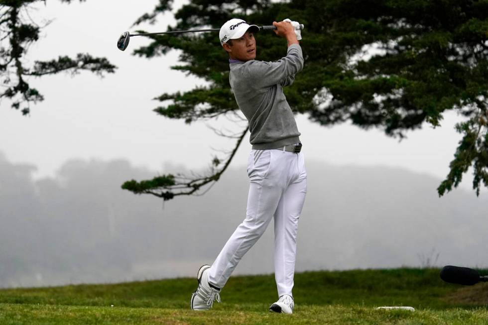FILE - Collin Morikawa watches his tee shot on the 16th hole during the final round of the PGA ...