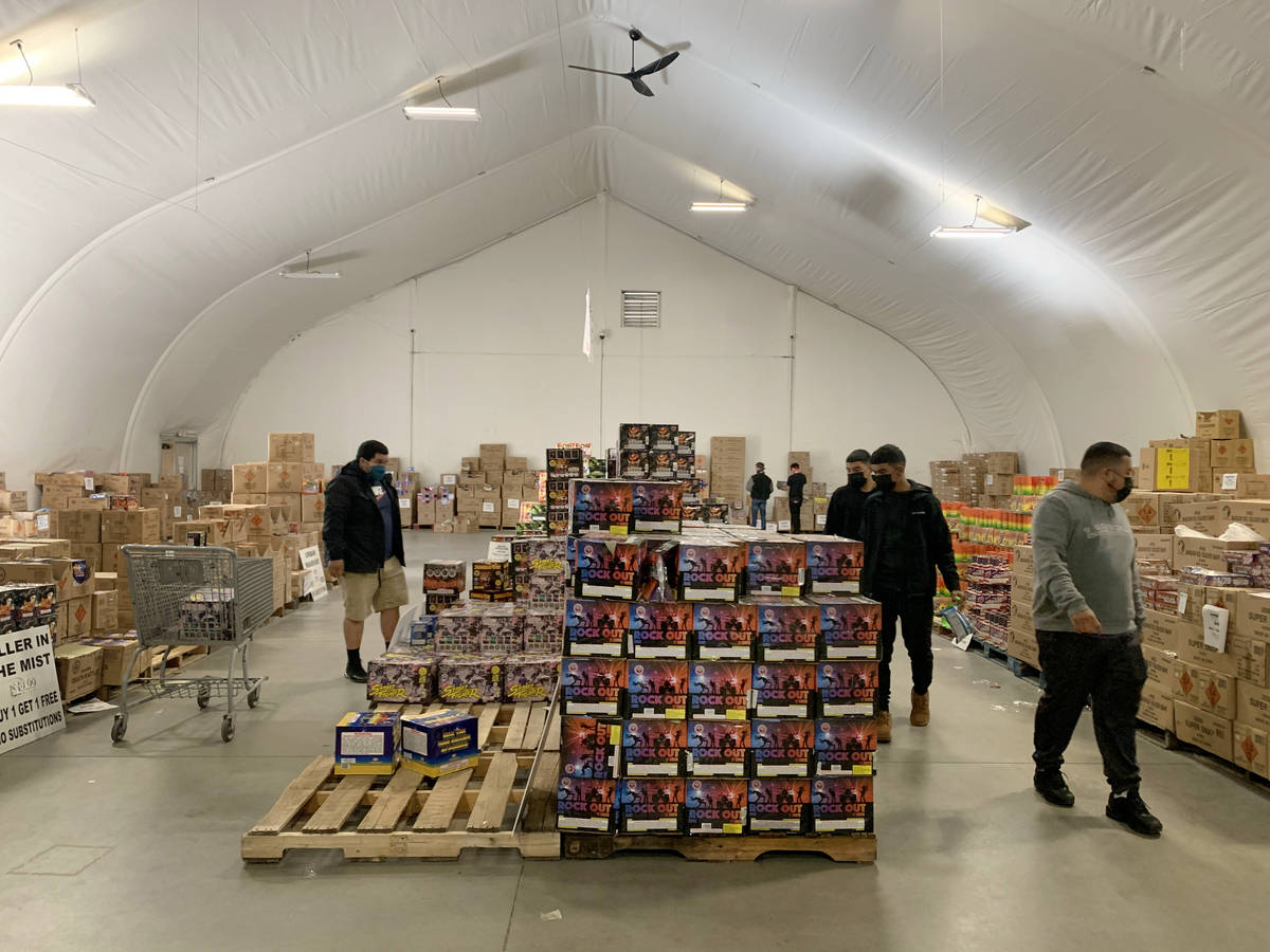 People shop for fireworks at Moapa Paiute Travel Plaza in Moapa on Tuesday, Dec. 29, 2020. (Eli ...
