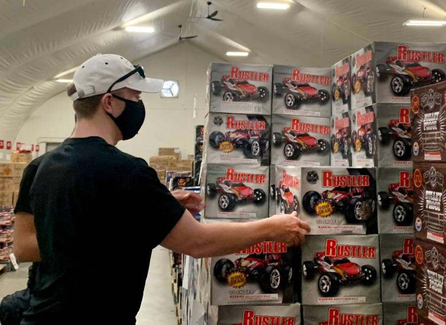 Jacob Kissman, 22, of Henderson, shops for fireworks at the Moapa Paiute Travel Plaza in Moapa ...