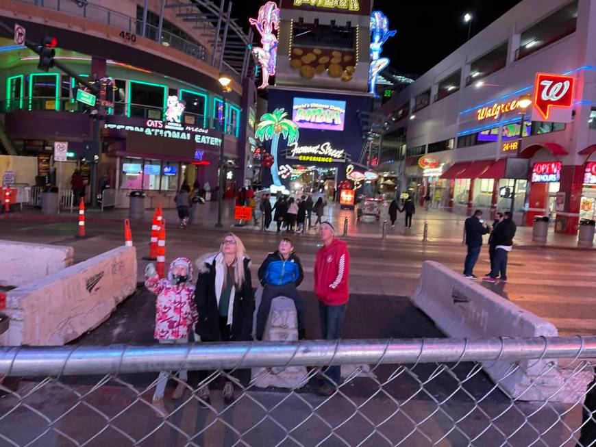 People wait on Fourth Street to watch the Fremont Street Experience light show on New Year's Ev ...