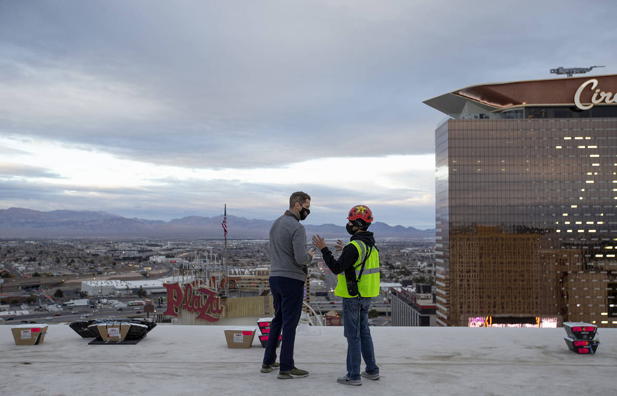 Jonathan Jossel, CEO of the Plaza, speaks with pyrotechnician Nate Tanner before the New Year's ...