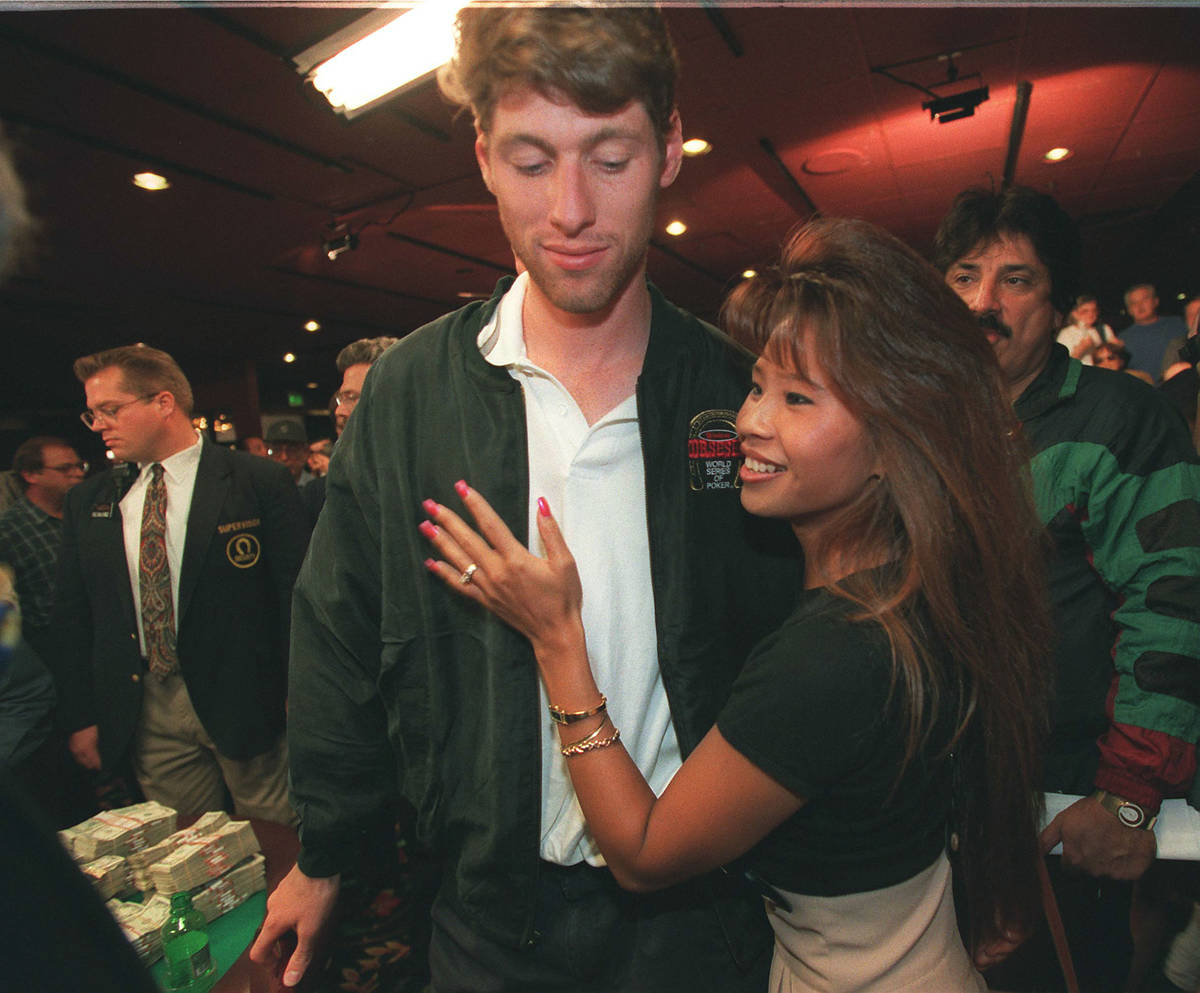 Huck Seed gets a hug from his girlfriend after winning the World Series of Poker on May 16, 199 ...