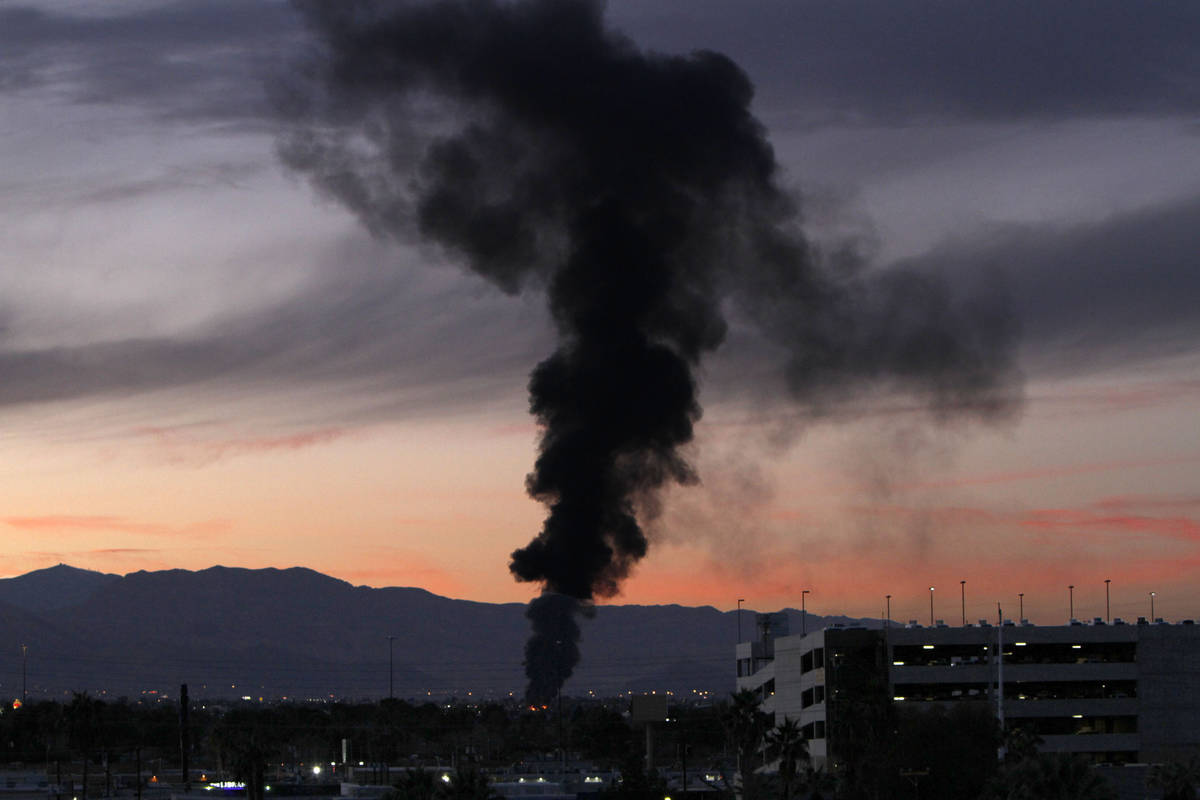 Black smoke is seen in Las Vegas, Wednesday, Dec. 30, 2020. Las Vegas Fire Department is on the ...