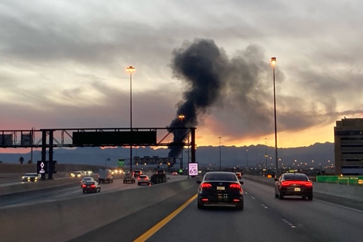 Commuters on U.S. Highway 95 view a fire Wednesday, Dec. 30, 2020, near Decatur in Las Vegas. ( ...