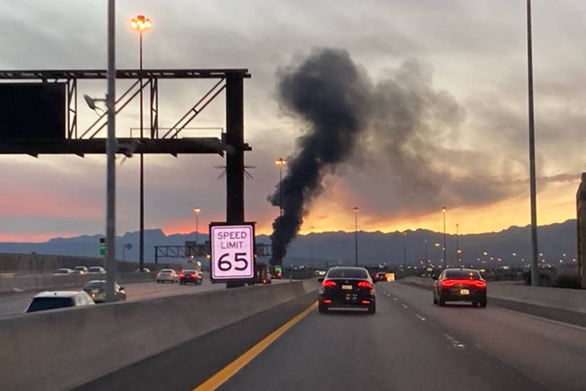 Commuters on U.S. Highway 95 view a fire Wednesday, Dec. 30, 2020, near Decatur in Las Vegas. ( ...