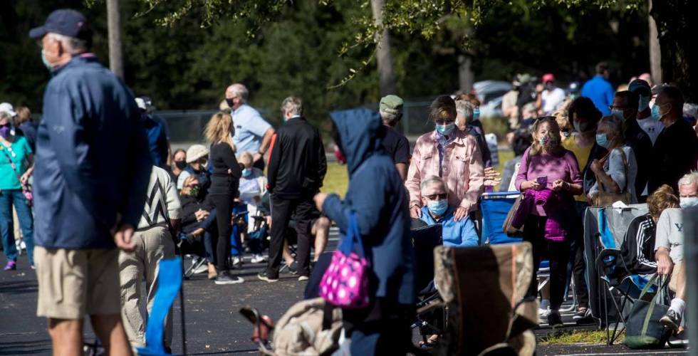 People wait in line wait in line to receive COVID-19 vaccines on Tuesday, Dec. 29, 2020, at Eas ...