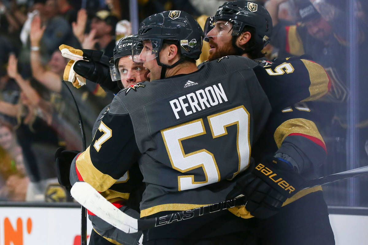 Golden Knights players, from left, Erik Haula, David Perron (57) and James Neal (18) celebrate ...