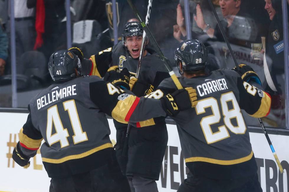 Vegas Golden Knights' Tomas Nosek (92) celebrates with Pierre-Edouard Bellemare (41) and Willia ...