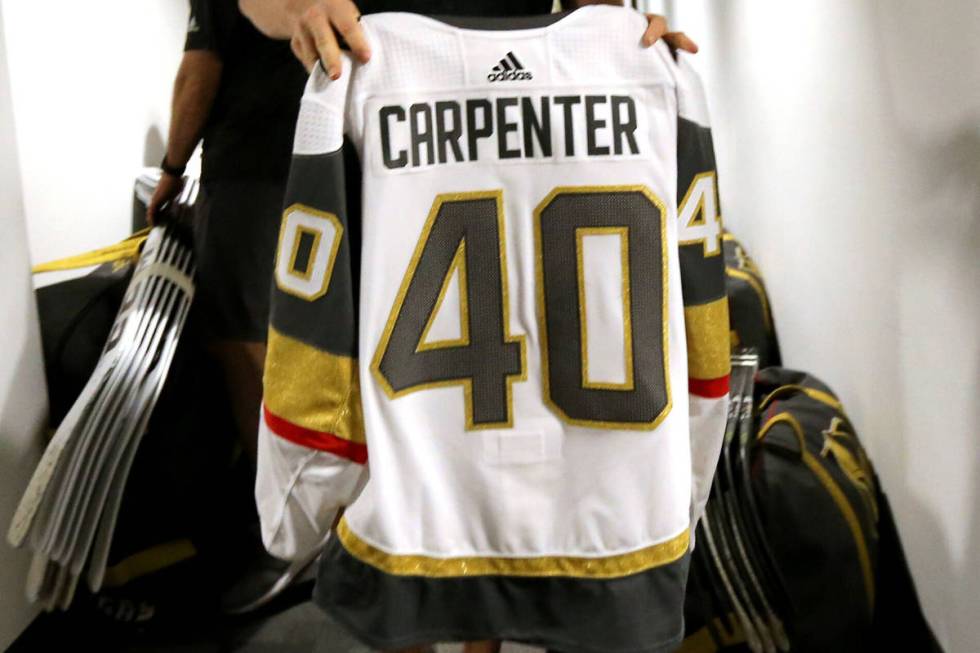 Vegas Golden Knights forward Ryan Carpenter, packs his sweater at City National Arena Friday, J ...