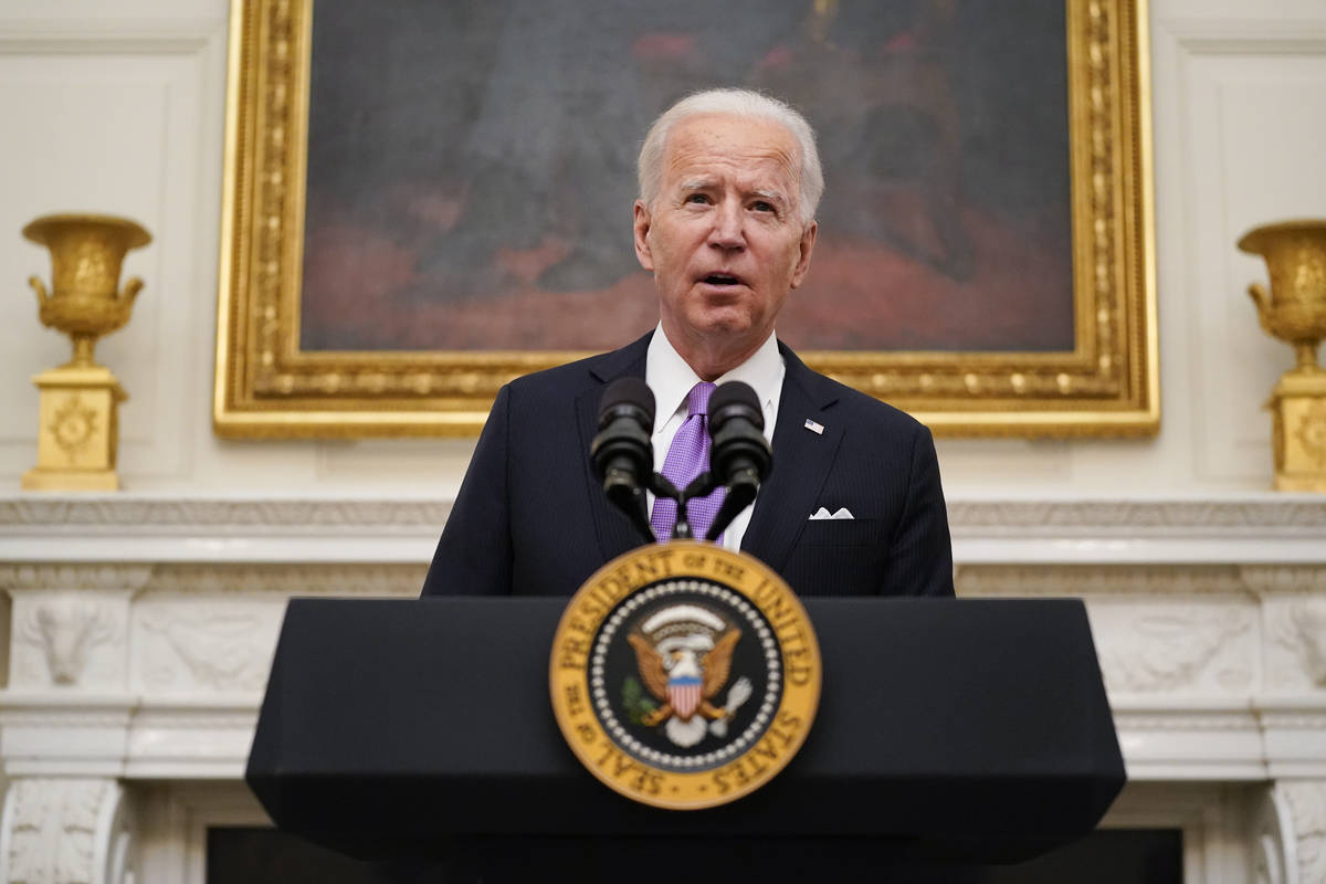 President Joe Biden speaks about the coronavirus in the State Dining Room of the White House, T ...
