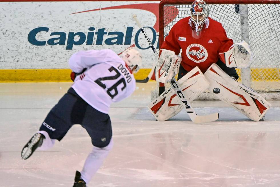 Washington Capitals center Nic Dowd (26) takes a shot on Capitals goaltender Ilya Samsonov duri ...