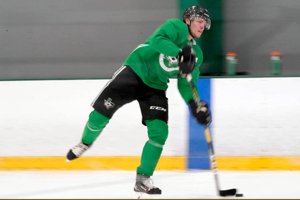 Dallas Stars defenseman Miro Heiskanen (4) passes the puck during NHL hockey training camp prac ...