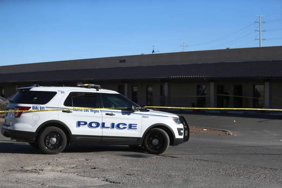 North Las Vegas police investigators work the scene of a fatal shooting near the intersection o ...