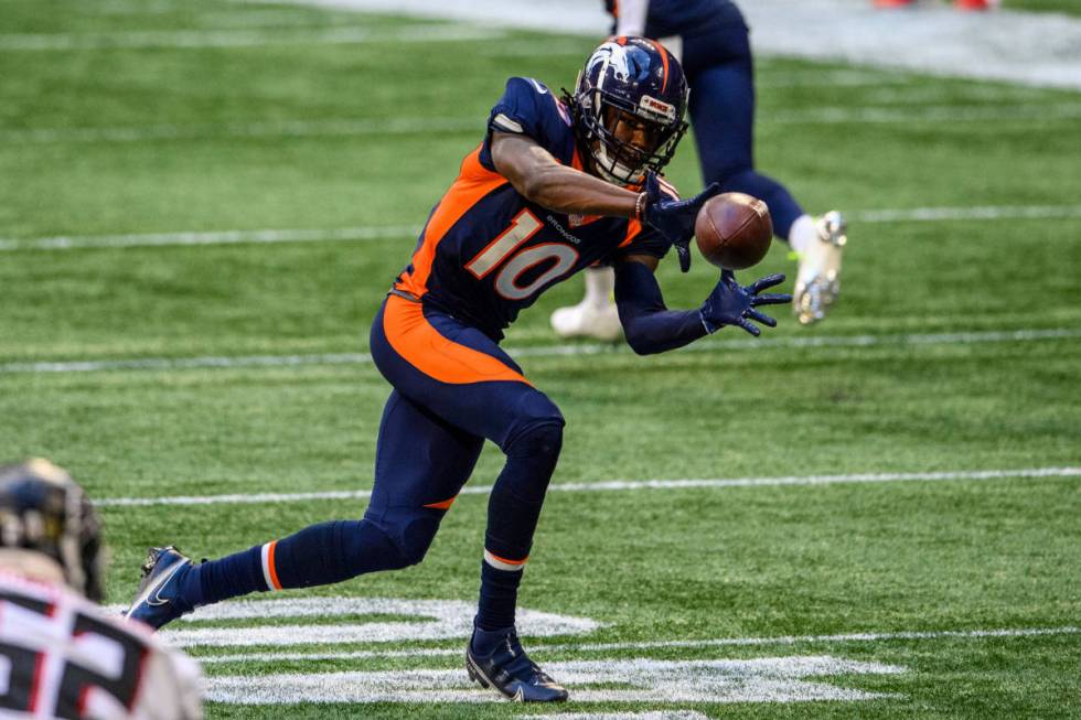 File-This Nov.8, 2020, file photo shows Denver Broncos wide receiver Jerry Jeudy (10) catching ...