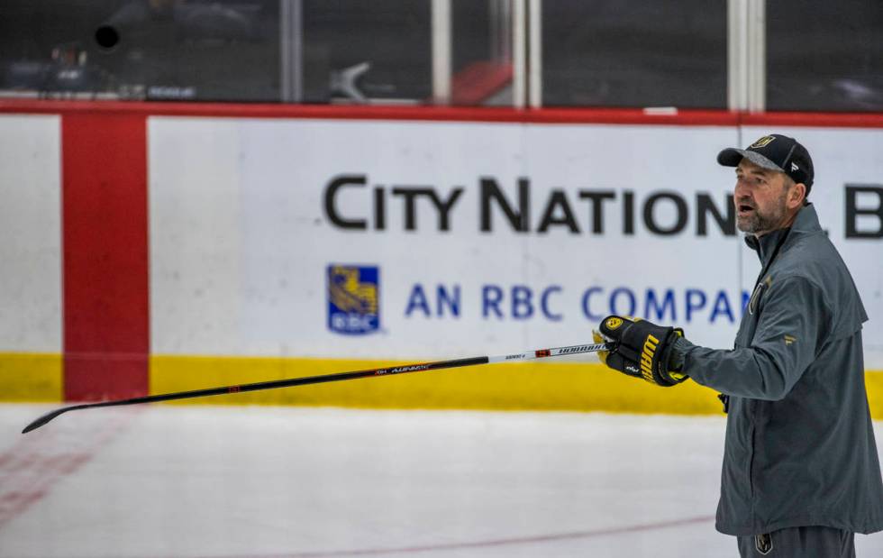 Vegas Golden Knights head coach Peter DeBoer yells instructions to his players during practice ...