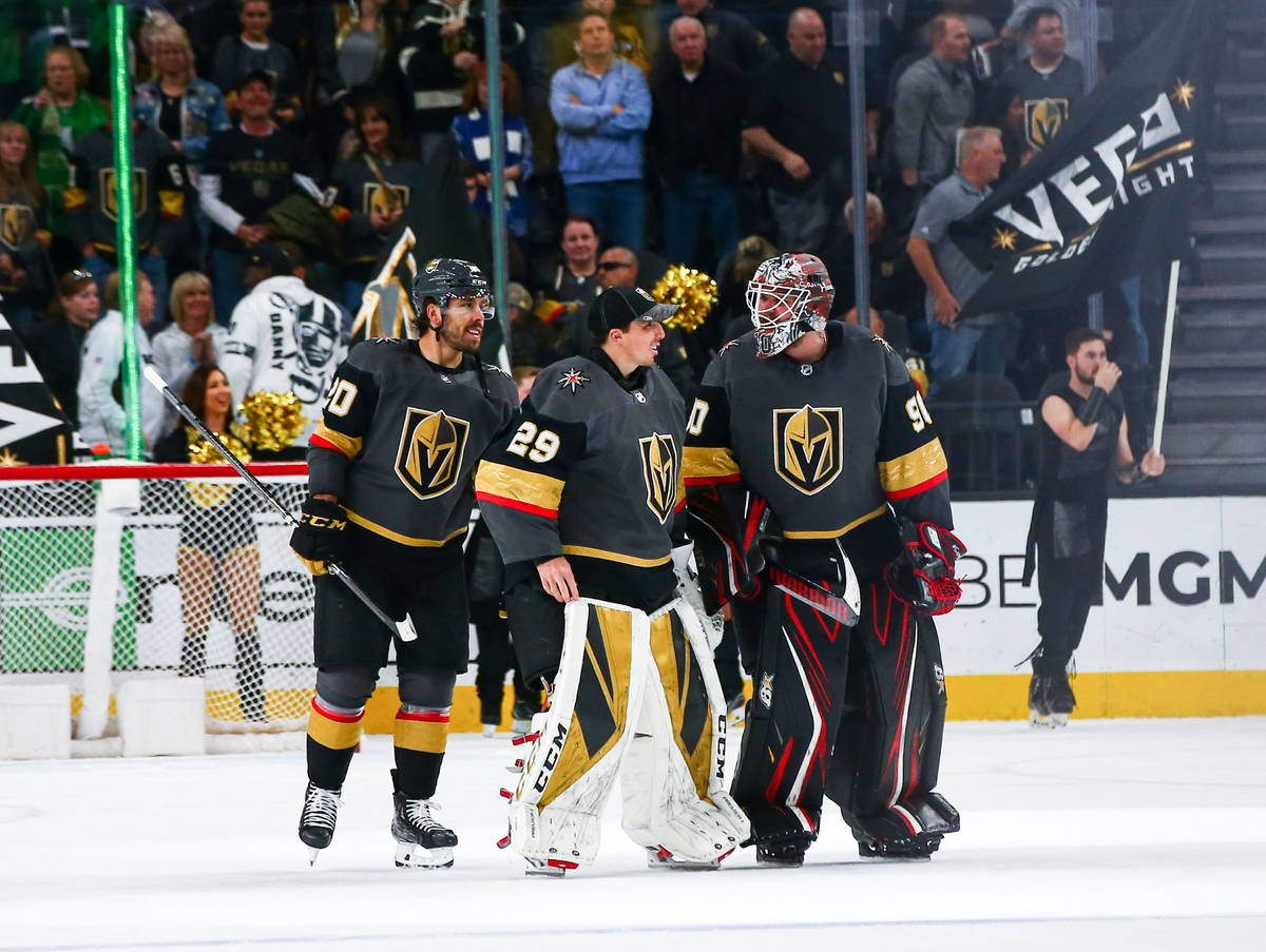 Golden Knights goaltenders Marc-Andre Fleury (29) and Robin Lehner (90) talk alongside Chandler ...