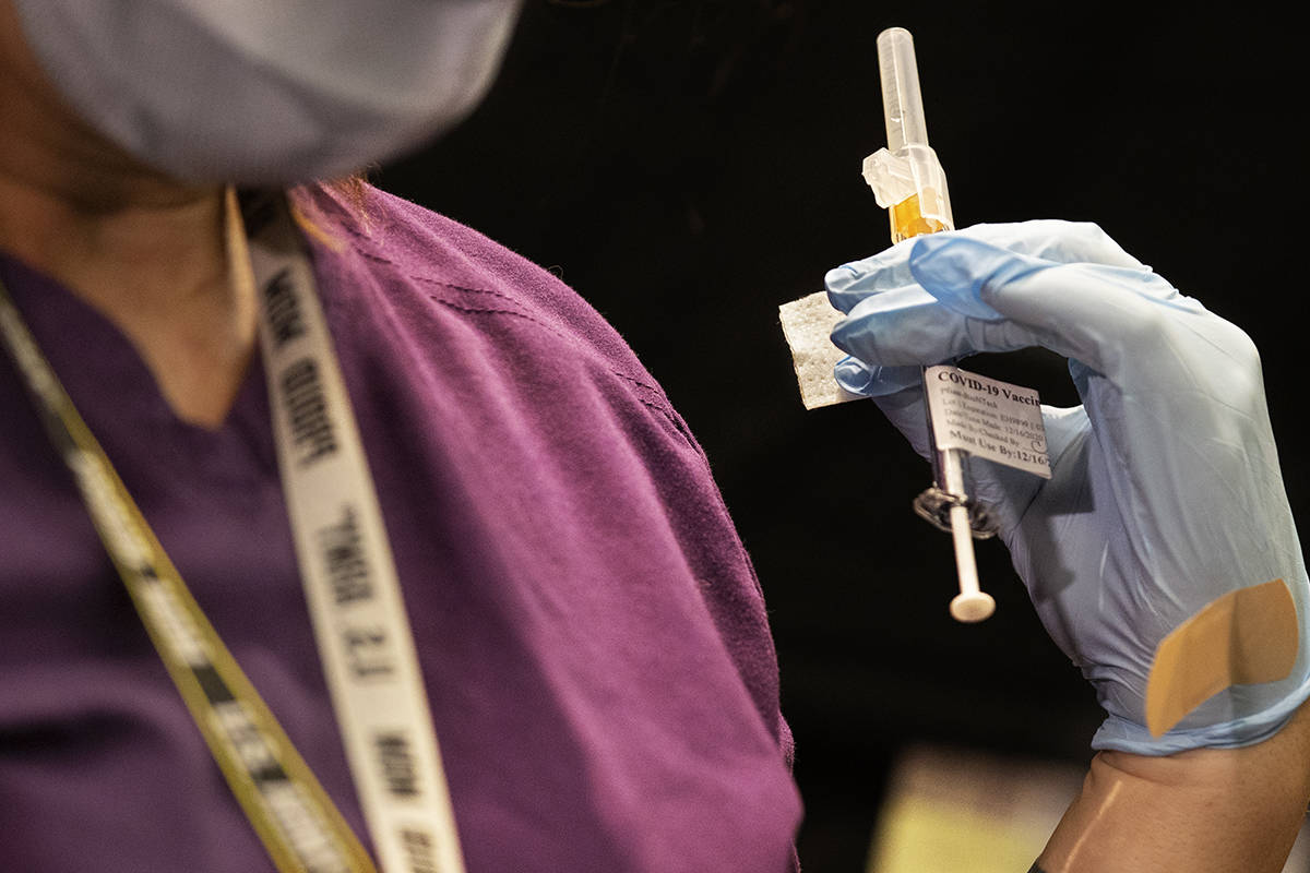 A syringe containing the COVID-19 vaccine at the North Las Vegas VA Medical Center on Wednesday ...