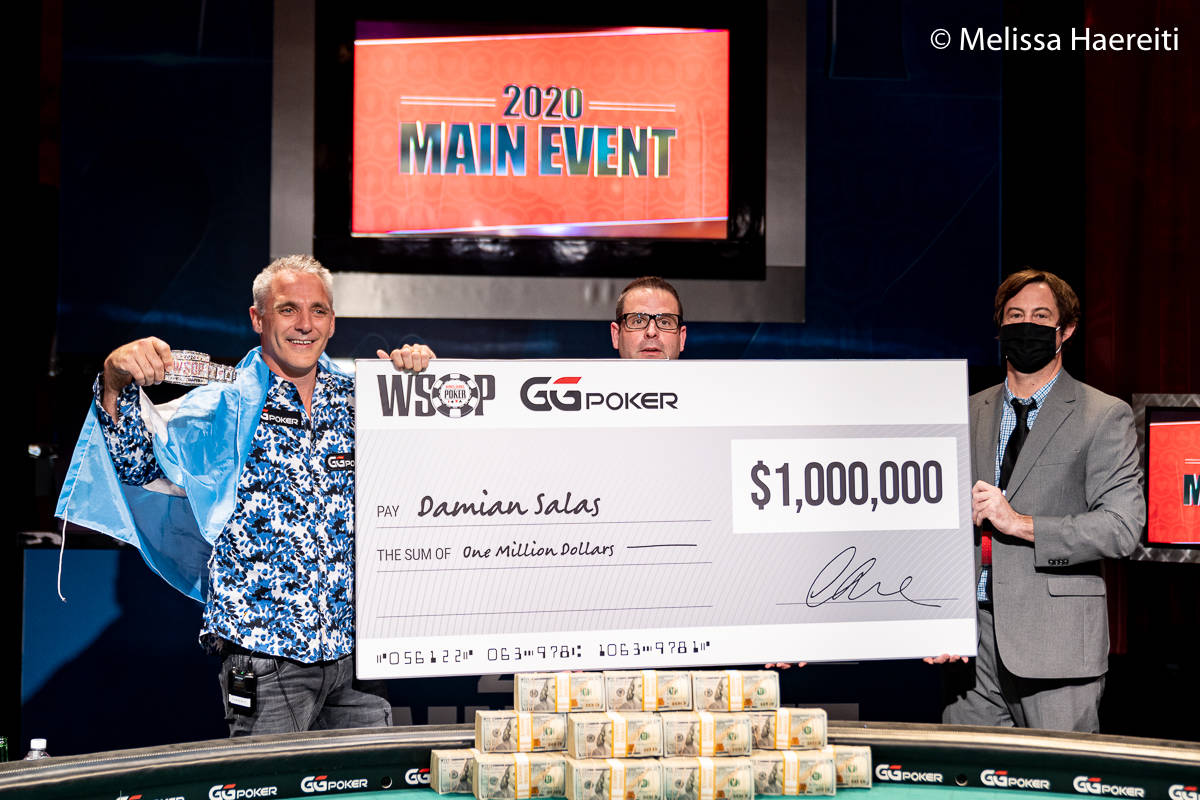 Damian Salas shows off his $1 million check for winning the World Series of Poker Main Event ti ...