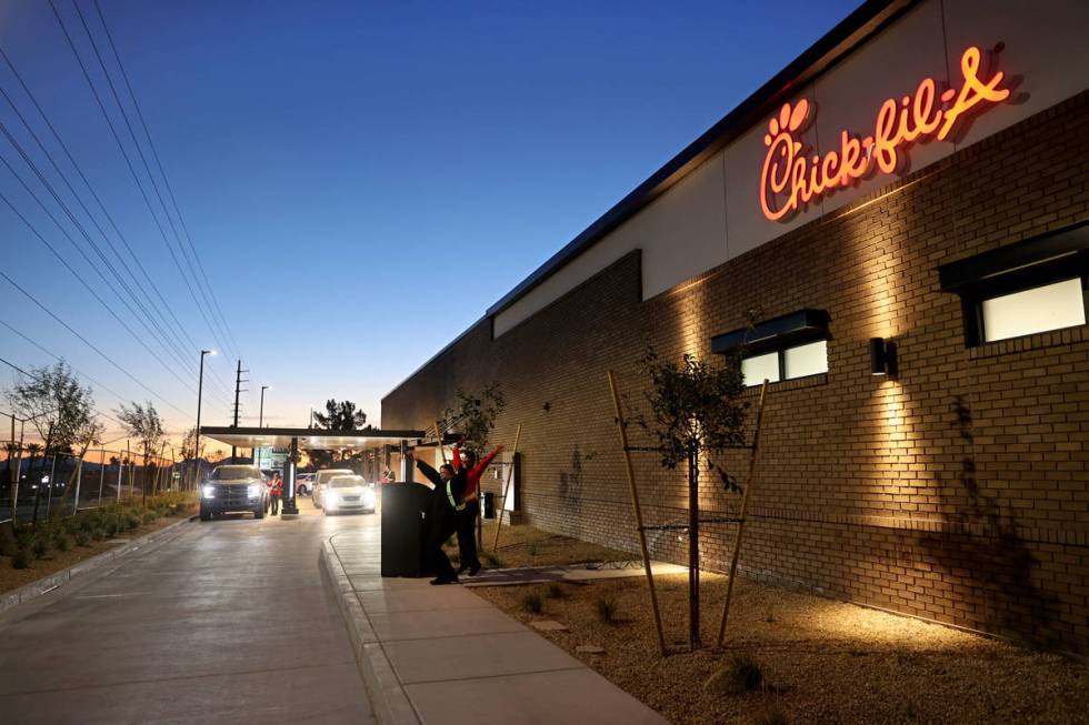 Stacy Wayne Slade of Las Vegas, left, is first in line for the grand opening of the 10th Chick- ...