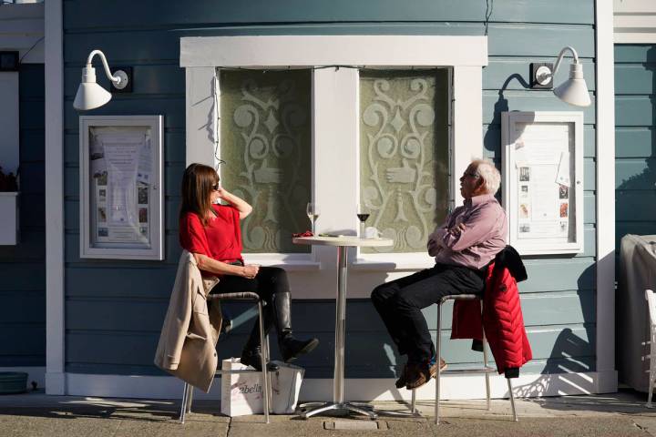 A couple dines outdoors at Scoma's restaurant Friday, Dec. 4, 2020, in Sausalito, Calif. (AP Ph ...