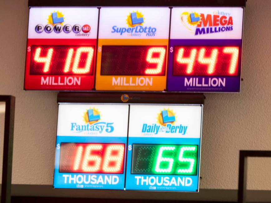 A Mega Millions and Powerball sign at The Lotto Store at Primm shows the current jackpots on Tu ...