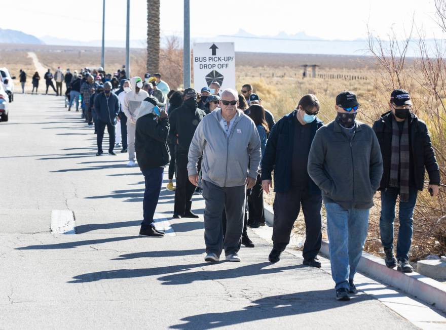 Hundreds line up outside of The Lotto Store at Primm as people wait to buy Mega Millions and Po ...