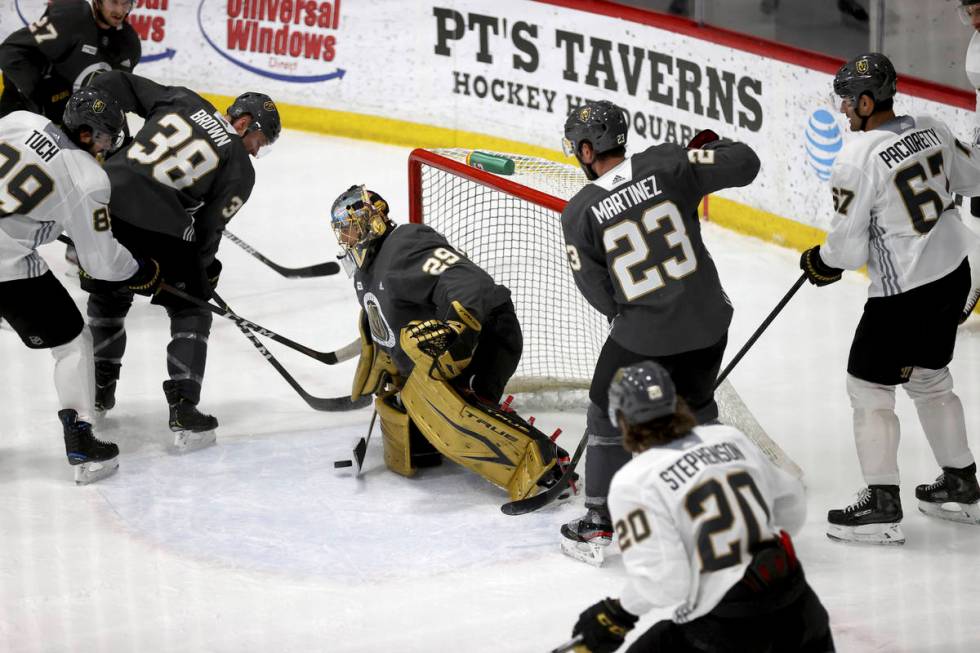 Vegas Golden Knights goaltender Marc-Andre Fleury (29) blocks a shot from forward Alex Tuch (89 ...