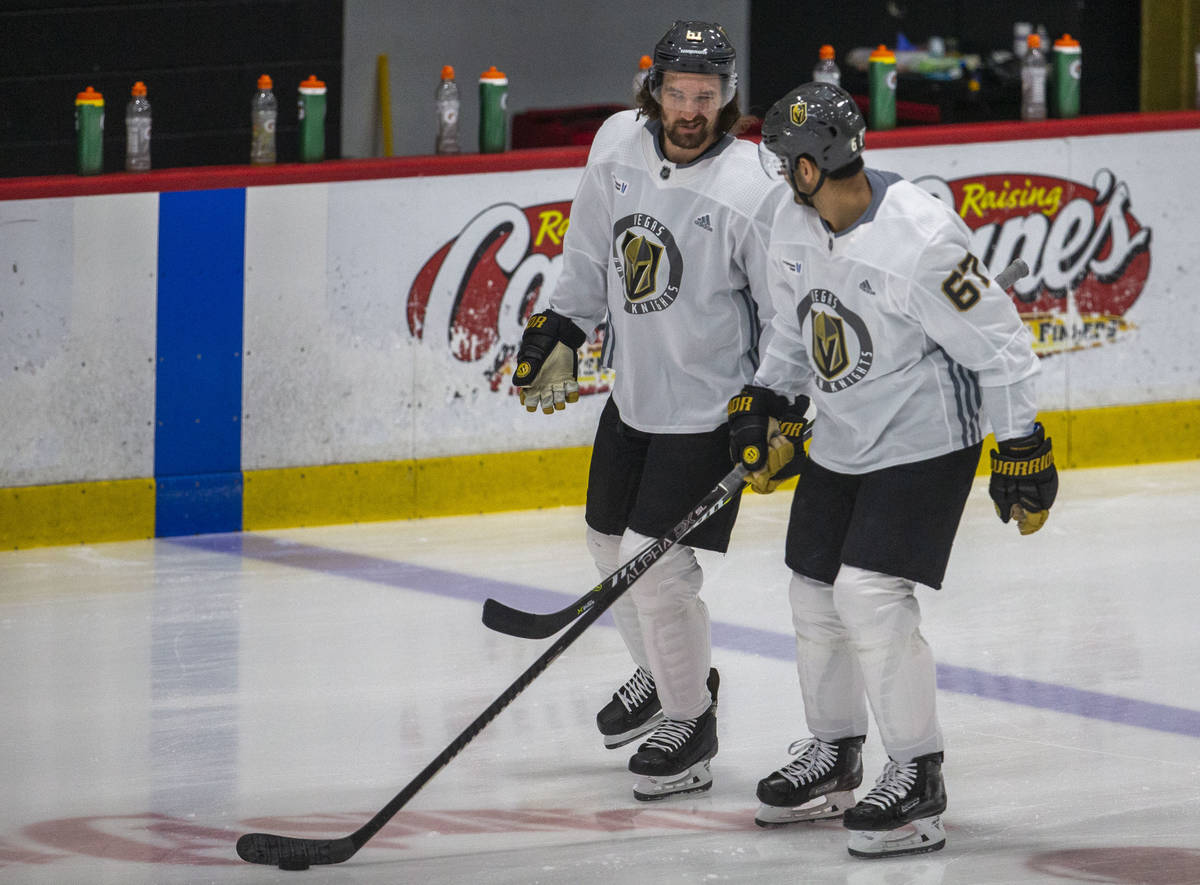 Golden Knights right wing Mark Stone (61) and Golden Knights left wing Max Pacioretty (67) skat ...