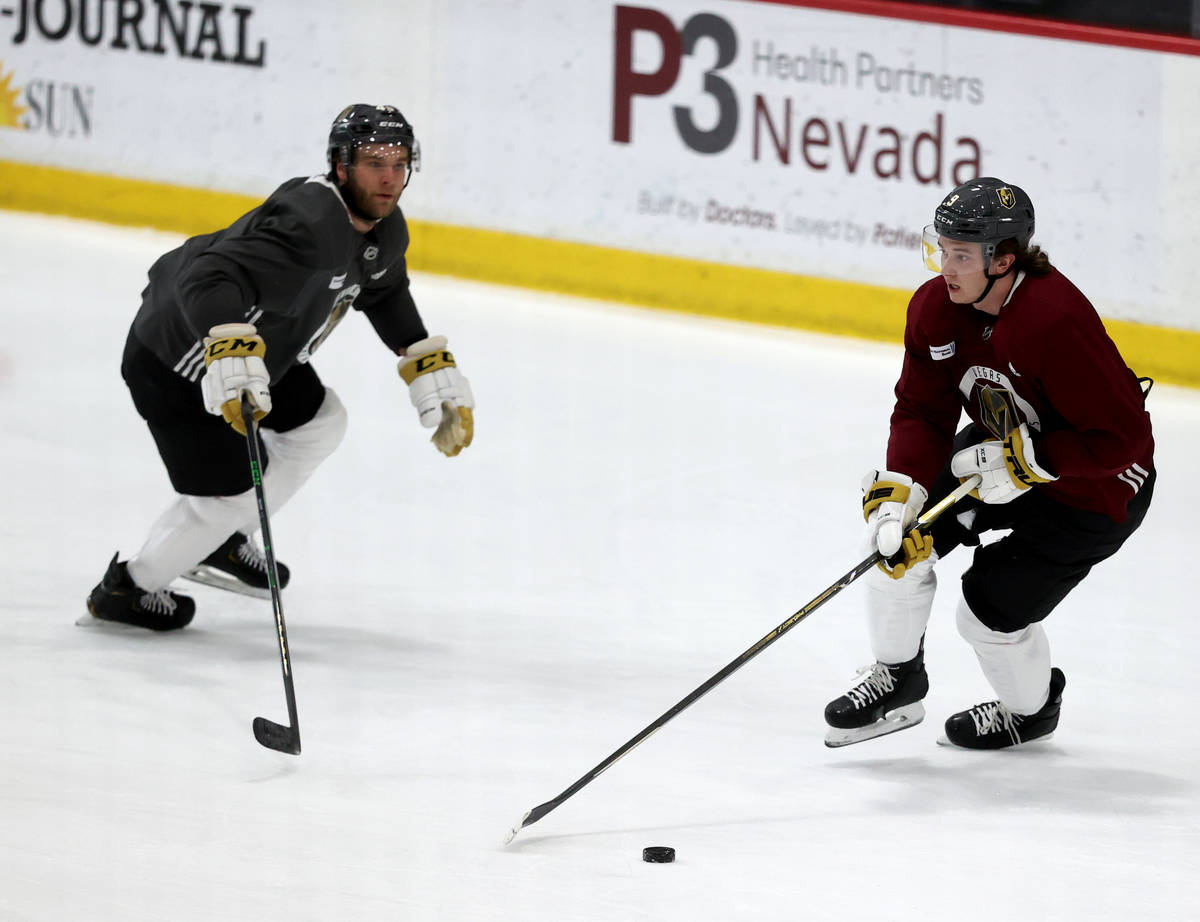 Golden Knights center Cody Glass (9) moves the puck past defenseman Jake Bischoff (45) during t ...