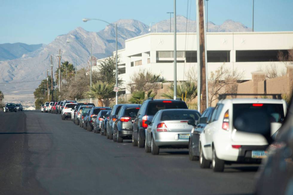 The line for COVID-19 testing at Texas Station's drive-through testing site wraps around Rancho ...