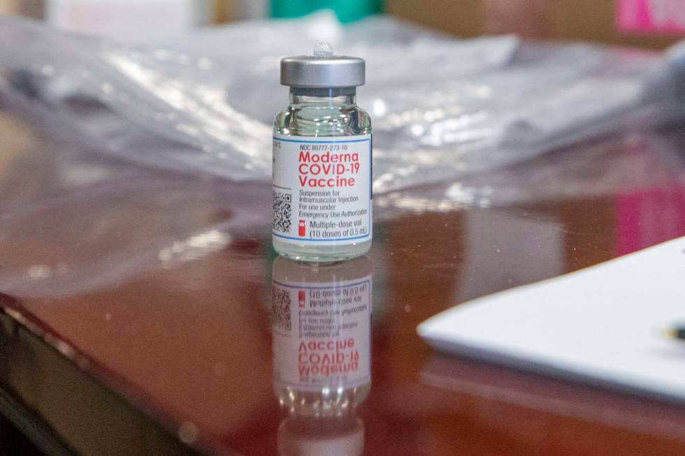 The North Las Vegas Fire Department administrates it’s first batch of a COVID-19 vaccine ...