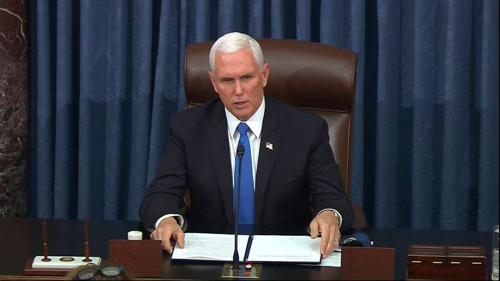 In this image from video, Vice President Mike Pence speaks as the Senate reconvenes after prote ...