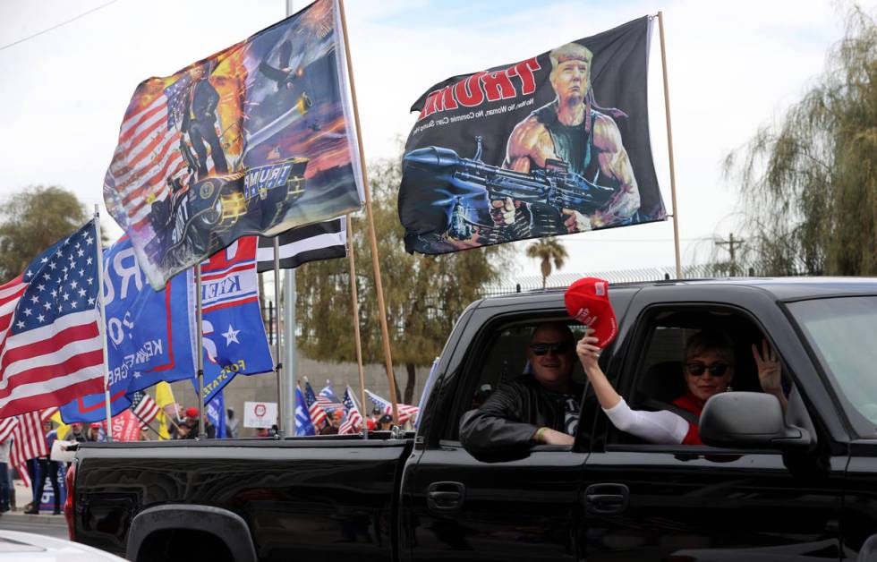 Protesters in a pro-Trump car parade outside the Lloyd George U.S. Courthouse in downtown Las V ...