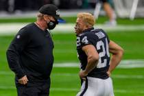 Raiders head coach Jon Gruden talks to Raiders strong safety Johnathan Abram (24) before an NFL ...