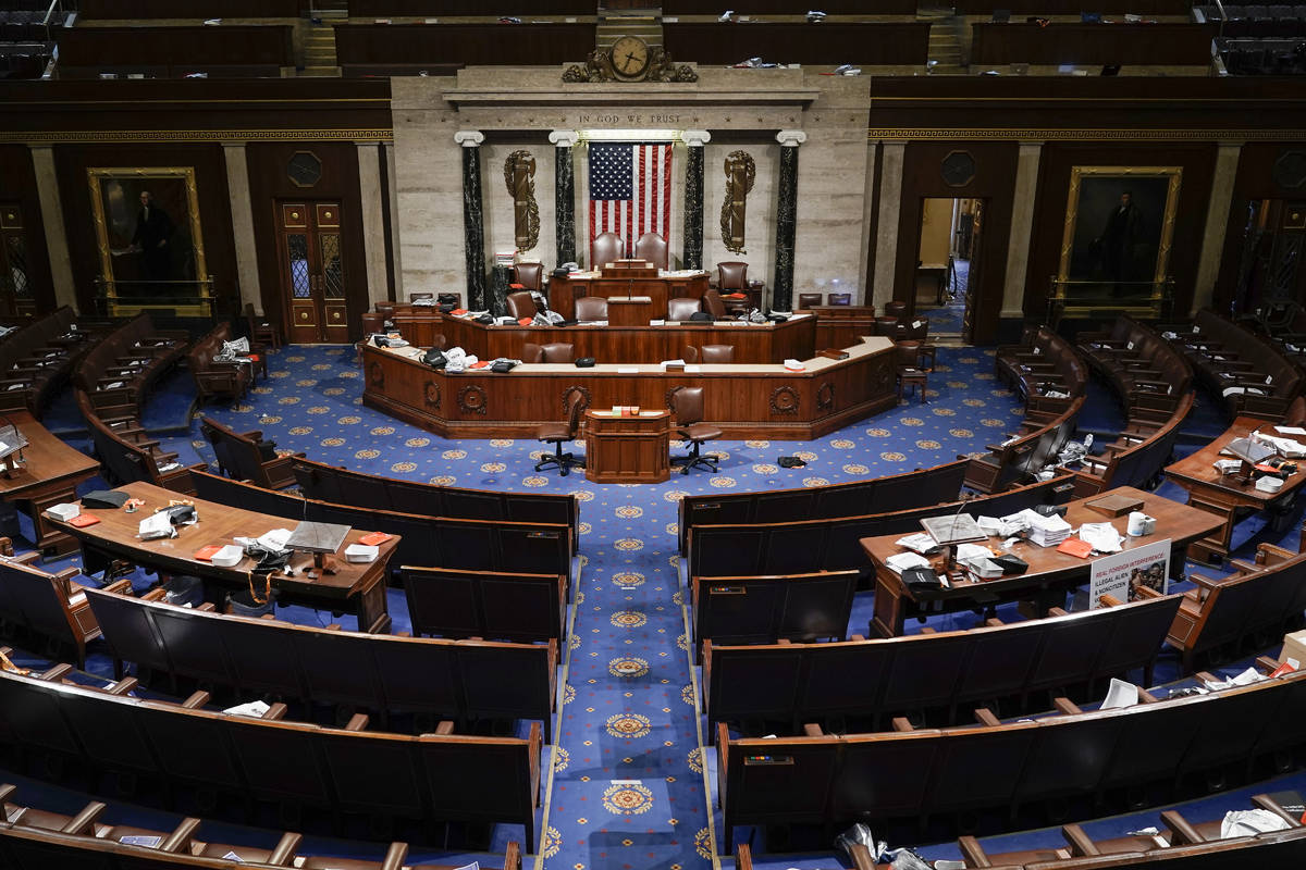 The House Chamber is empty after a hasty evacuation as protesters tried to break into the chamb ...