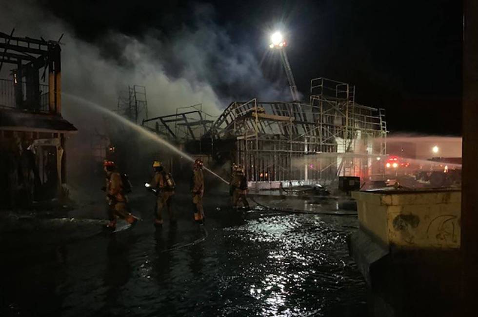 Las Vegas firefighters battle a fire at the Winslow condo development in the 5700 block of Sky ...