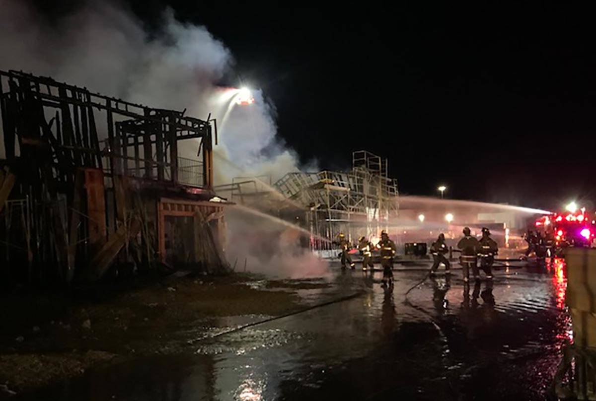 Las Vegas firefighters battle a fire at the Winslow condo development in the 5700 block of Sky ...