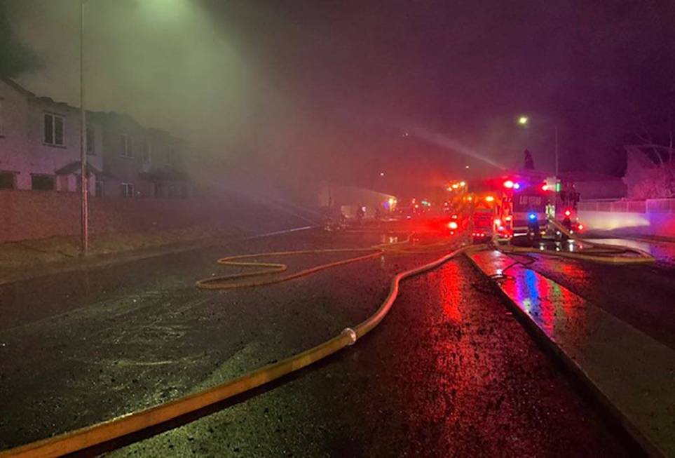 Las Vegas firefighters battle a fire at the Winslow condo development in the 5700 block of Sky ...