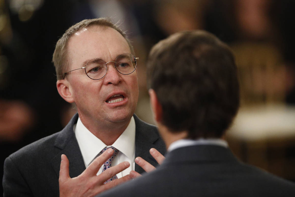 In this Feb. 6, 2020, file photo, White House acting chief of staff Mick Mulvaney mingles with ...