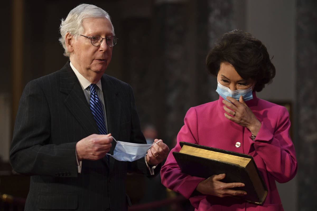 In this Jan. 3, 2021, file photo, Sen. Mitch McConnell, R-Ky., participates in a mock swearing ...