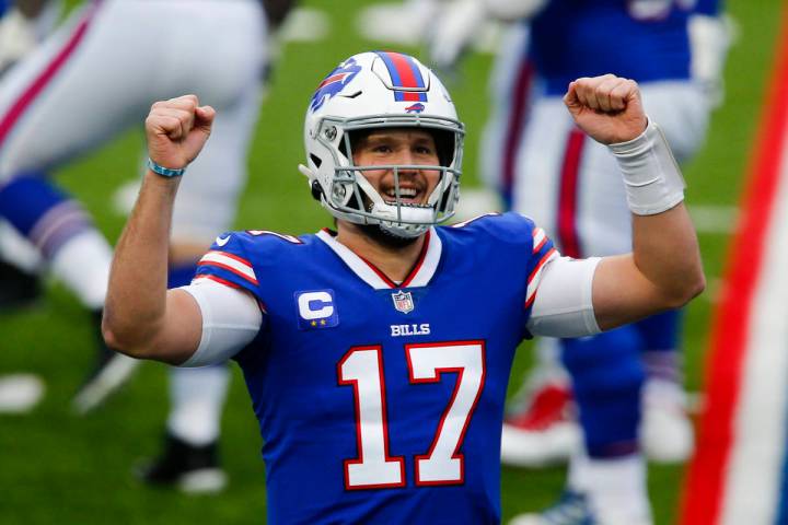 Buffalo Bills quarterback Josh Allen (17) reacts after throwing a touchdown pass in the first h ...