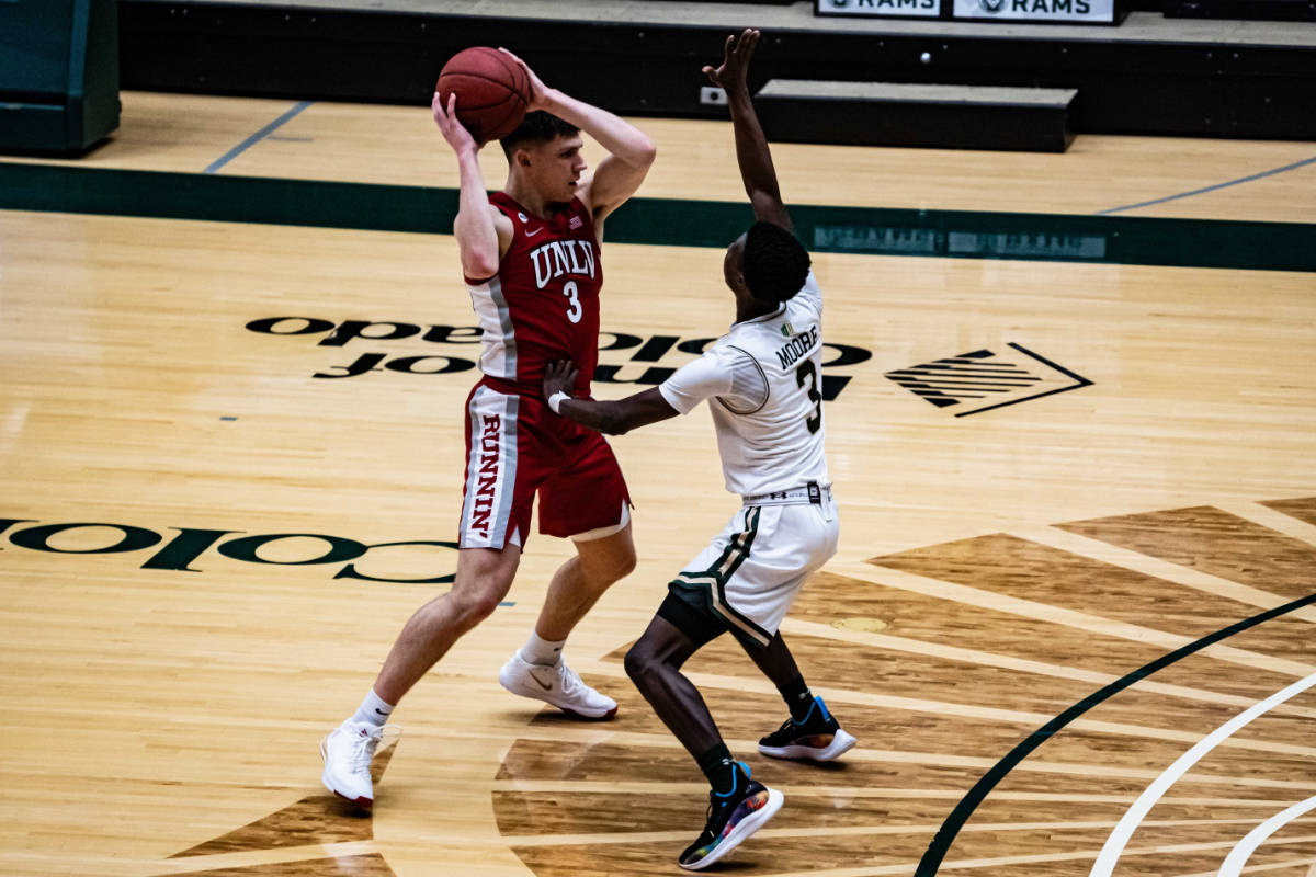 UNLV guard Caleb Grills looks to pass in the Rebels' game at Colorado State on Saturday. Photo ...