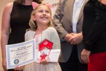 Award winner Rylee Bannister, left, a second grader from Staton Elementary School, smiles at th ...