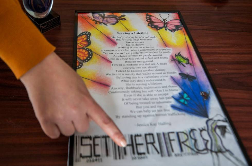 Youthcare program director Jessica Halling shows a poem she wrote, in her office at St. Jude's ...